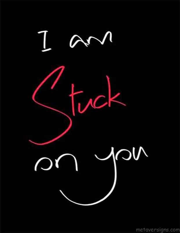 Romantic images of valentines day. 
I am stuck on you is written on a black image in handwriting style in white and red color. It looks so romantic.